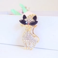 Golden cat keychain with rhinestones, black gemstone eyes and a cute bow accessory - White