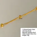 Macro shot of 18k gold plated 1.2mm snake chain with three 3mm beads in stainless steel - 1.2 Round Snake Chain with 3mm Round Beads