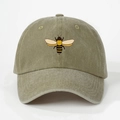 Detail of an olive green washed cotton baseball cap with a printed bee motif on front - One Size / Dark Khaki