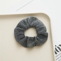 Detail shot of black and white pleated polyester hair scrunchie on a white tray - Silver Gray