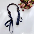 Detail of dark blue nylon strap with gold twill accents and plastic buckle for bags - Navy Blue Shoulder Strap