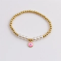 Goldenes Perlenarmband mit weißen Perlen und pinkfarbenem Evil Eye Anhänger für Damen - Rosa