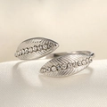 Detailed view of silver leaf ring with micro-pave zircons on white silk background - Adjustable Open / Steel Color Leaf White Zircon