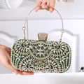 Luxurious emerald green evening clutch with sparkling floral rhinestones and gold handle - Green
