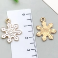 Golden snowflake charm with white enamel finish and 2.3cm measurement display - White Snowflake 17x20mm
