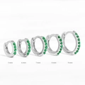 Set of five silver hoop earrings with green stones in sizes 5mm to 9mm shown on white background - 6mm / Platinum/Green Zirconia
