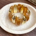 Golden metal and amber marble resin acrylic cuff bracelet with a vintage wide design - Brown