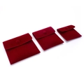 Three sizes of red velvet jewelry pouches with snap buttons arranged diagonally - Long Plush / Small (7x7cm) / Burgundy