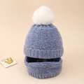 Close-up of knit baby beanie and neck warmer set in grey blue with white fluffy pompom - Blue