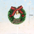 Detailed view of a green Christmas wreath cake topper with red bow and gold bell - Striped Bow Pine Wreath Style