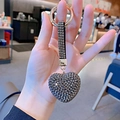 Close-up of a luxury heart-shaped rhinestone keychain with golden metal ring detail - Gunmetal