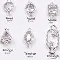 Detailed close-up of six zircon-inlaid 14K gold-plated connectors for DIY jewelry making - Heart (5.5mm) / Silver (Color Retention)