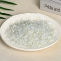 Natural white crystal crushed stones displayed in a white ceramic tray for aromatherapy - 100g Of Synthetic Opal (5-7mm)