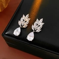 Macro shot of silver wheat ear earrings with pear-shaped cubic zirconia on black leather - Silver (Silver Pin) / Silver