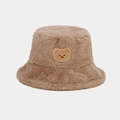 Close-up of plush brown bucket hat featuring a cute bear embroidery and thick faux fur texture - One Size / Khaki