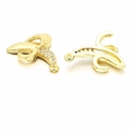 Dettaglio di ciondoli a banana dorati con strass bianchi e finitura lucida a specchio - Banana in Zircone Trasparente / Oro