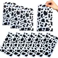 Cow print plastic gift bag with die-cut handles for party favors and candy packaging - Cow Print
