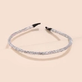 Close-up of glitter silver headband with shimmering sequins and protective black end caps - Silver