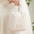 Neceser de cuero PU blanco crema con asas superiores y detalle de logo dorado - Beige