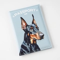 Detailed view of light blue PU leather passport holder with Doberman print and white text - Blue Dog