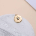 Detail of gold-plated starburst pendant with crystal on marble display stand - Star Burst Round Style (5#)