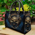 Elegant black PU leather handbag featuring a golden skull print on a natural garden backdrop - Blue Geometric Gold Skull (手提包0038)