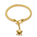 Elegant gold twisted rope bangle featuring a detailed sea turtle charm pendant - Tortoise Pendant / Gold