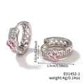 Detailed view of silver hoop earrings with pink zircon flower and white accent stones - Silver/Pink Flower