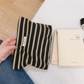 Macro detail of simple wish woven label on striped cotton canvas cosmetic makeup bag - Black Base Khaki Stripe