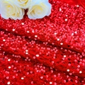 Sparkling red sequin table runner for party decor with elegant white roses - Red Velvet