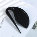 Macro detail of safe black envelope opener with embedded blade and ergonomic grip - Black