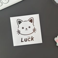 Cartoon cat sticker with Luck text on white background for water bottles and journals - Metallic Silver (Cat)