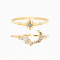 Detailed macro view of gold-plated star and moon rings set with colorful zircon stones - US 7 / Gold