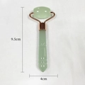 Resin amber facial roller massager in light green with rose gold metal bracket - Light Green