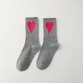 Grey cotton crew socks with vibrant pink heart pattern in a classic flat lay view - Grey with Rose Pink Heart