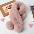 Detail of pink faux rabbit fur scarf with soft pompoms on a cozy styled white surface - Dusty Pink