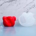 Detailed view of DIY knot candle silicone mold and a red finished wax candle on a pedestal - Knot Candle Ornament Mold