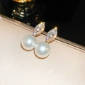 Macro shot of faux pearl earrings with marquise rhinestones on a velvet tray - Water Drop Zirconia Pearl Drop