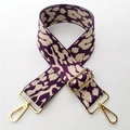 Detail of 5cm wide leopard jacquard bag strap with gold metal swivel lobster clasps - Purple