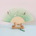 Japanese style folding fan with crane and rabbit pattern, bamboo ribs and green tassel - White Ribs Style 52