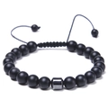 Detail of 8mm matte black beads and silver metallic charm on adjustable braided bracelet - Matte Stone Bracelet