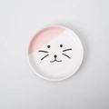 Flat lay of round ceramic cat bowl with pink detail and minimalist feline face design - Pink Cat Face Plate