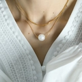 Elegant gold double layer snake chain necklace with a large white pearl pendant on model - Gold Double Layer Style (XL11)