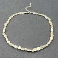 Detail of irregular natural cream stone beads with stainless steel lobster clasp and chain - Creamy Moonstone