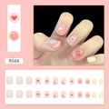 Macro detail of R568 pink press-on nails with heart and star patterns in a 24pc set - R568 Pink Heart