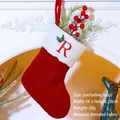 Red knit Christmas stocking with white cuff featuring red letter R and holly embroidery - Letter R / Red
