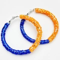 Detail of large hoop earrings with glitter finish in blue and orange contrast - Blue/Orange