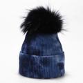 Detail of navy tie-dye knit beanie featuring a fluffy black pompom and ribbed texture - Dark Blue and Navy Tie-Dye (6#)