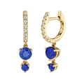 Macro detail of 14K gold hoop earrings featuring round blue sapphire drop pendants - Blue