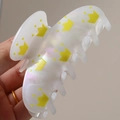 Iridescent white hair claw clip with yellow crown pattern held in hand - Yellow Crown (H596)
